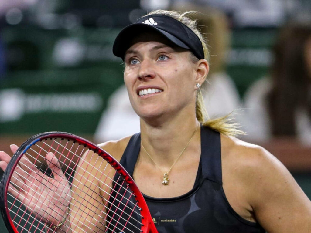 Angelique Kerber smiling looking up holding tennis racket wearing athletic gear and visor on court Wallpaper