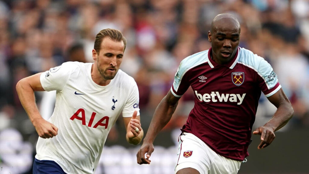 Angelo Ogbonna competing fiercely for the ball in an intense high stakes football match wallpaper