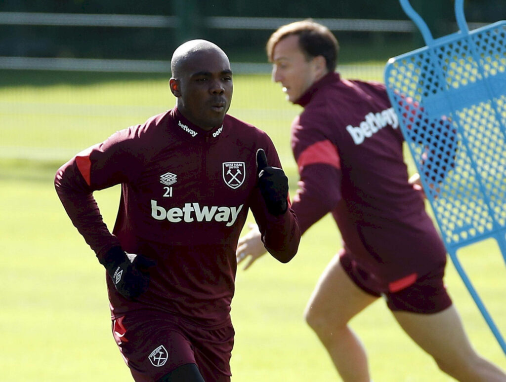 Angelo Ogbonna trains in West Ham kit showing dedication and athleticism on practice field Wallpaper