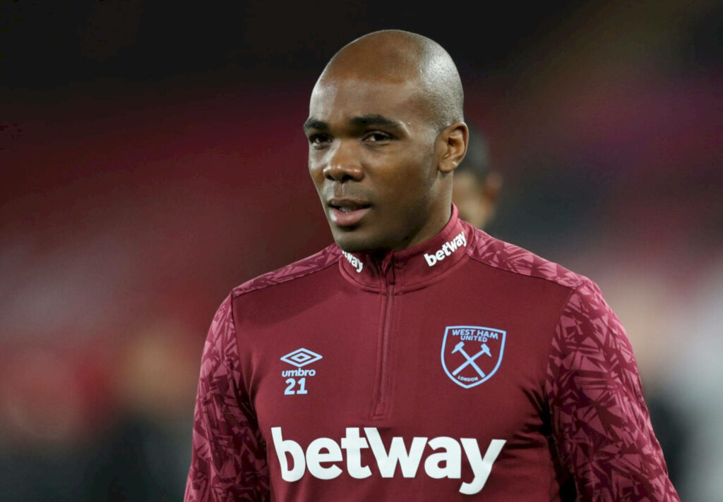 Angelo Ogbonna in West Ham maroon training jacket focused during team practice session wallpaper