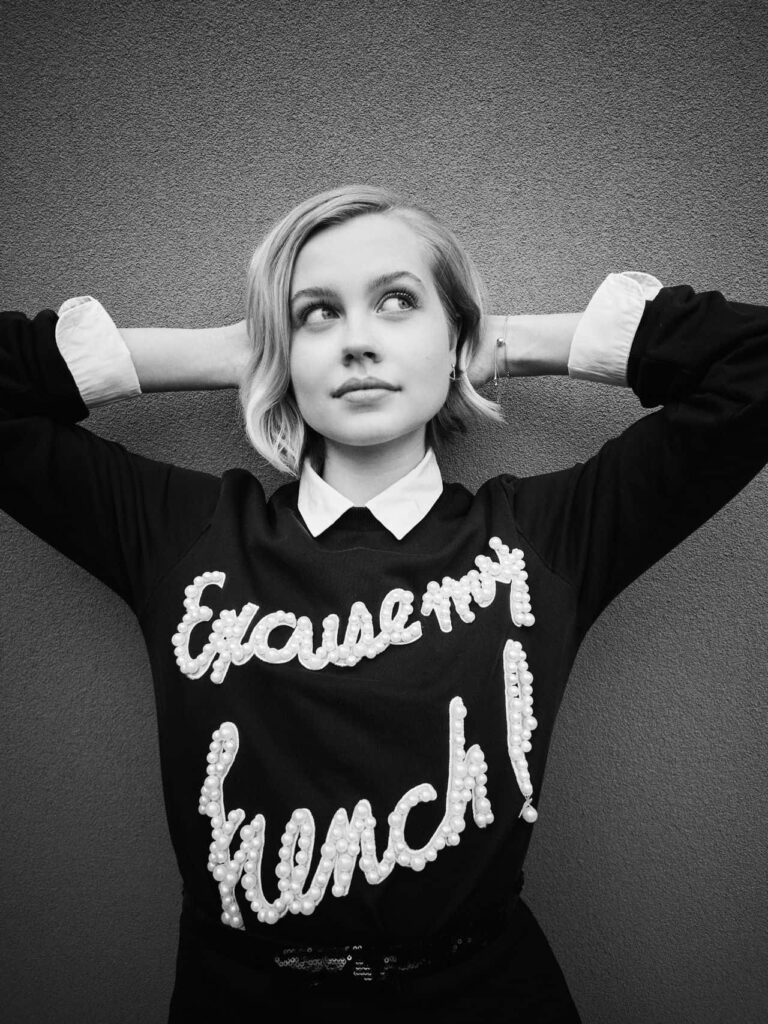 Angourie Rice in black and white portrait wearing Excuse My French sweater stylish wallpaper
