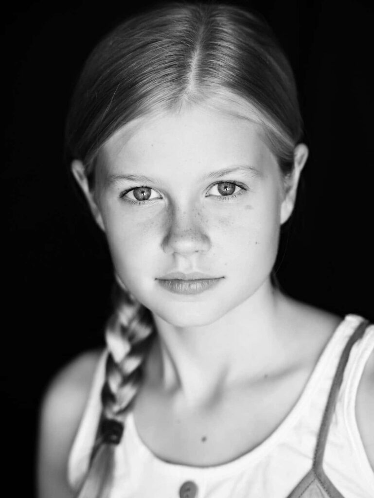 Black and white portrait of young Angourie Rice with gentle expression natural beauty wallpaper