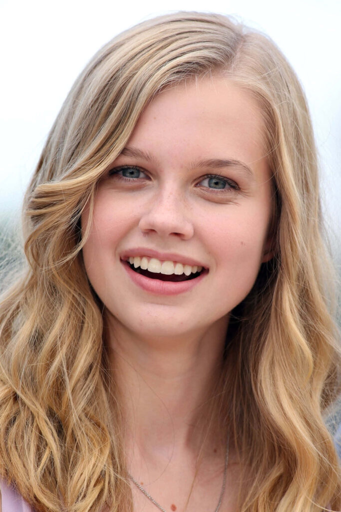 Angourie Rice vibrant wallpaper blonde hair smiling youthful charm bright background