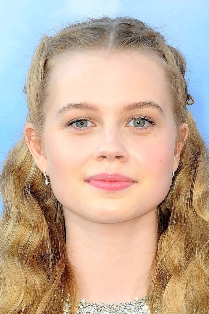 Closeup of Angourie Rice with soft waves subtle makeup serene expression event wallpaper background
