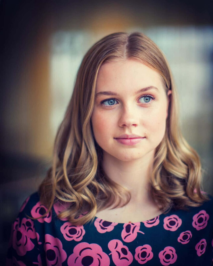 Angourie Rice portrait wallpaper in floral dress soft lighting blonde hair gentle expression