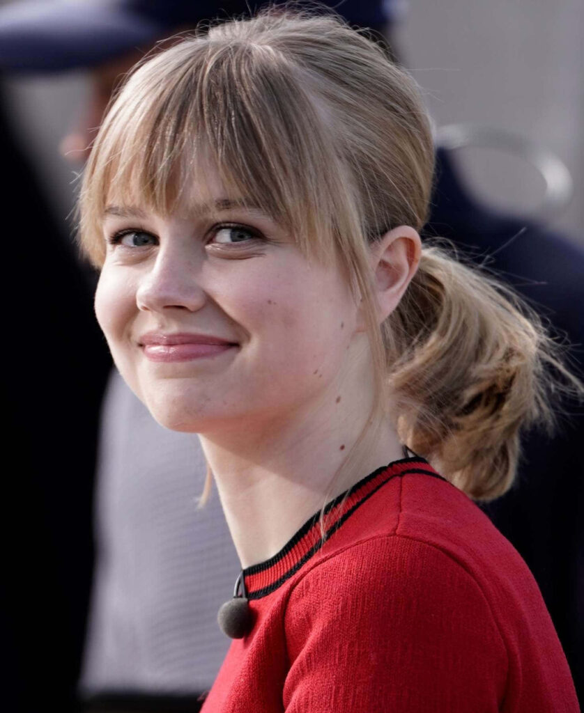 Angourie Rice smiling portrait in red top natural makeup candid wallpaper background