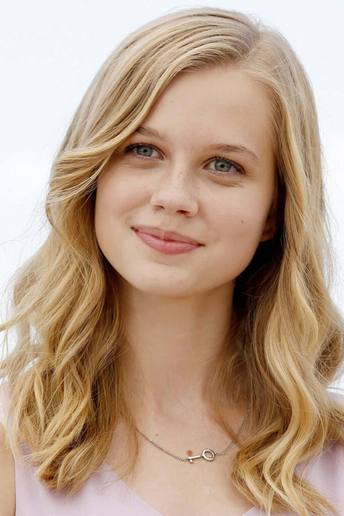 Angourie Rice portrait wallpaper with soft blonde hair and gentle smile showcasing natural beauty