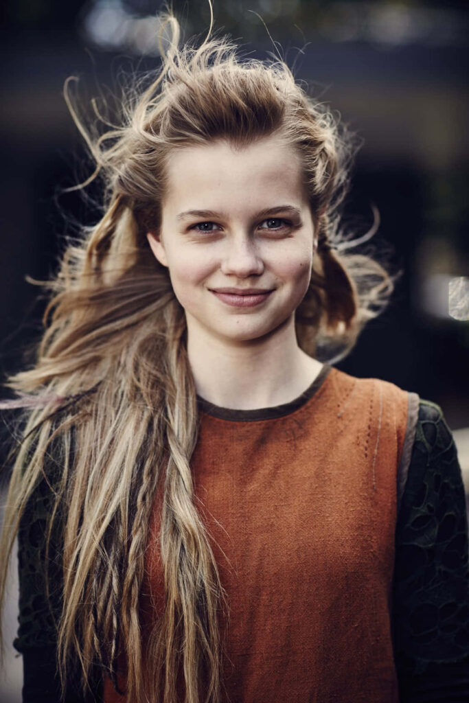 Angourie Rice portrait with wind tousled hair and soft smile natural elegance wallpaper background