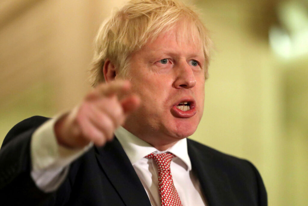 Angry Boris Johnson pointing fingers with intense expression dynamic leadership wallpaper