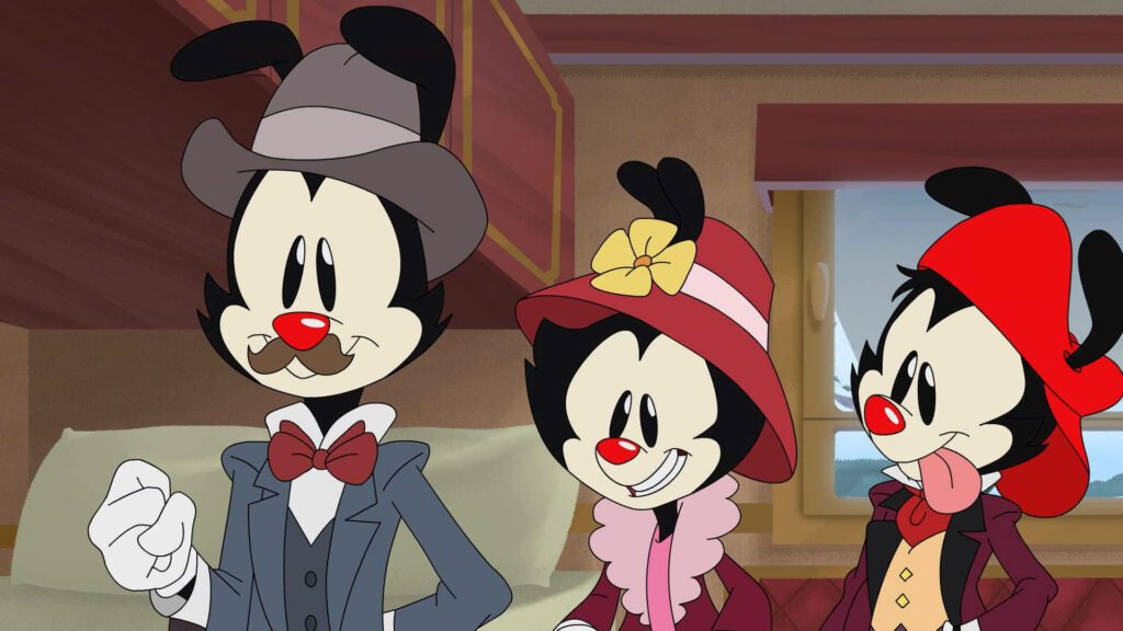 Animaniacs Warners in vintage outfits inside train carriage cheerful classic cartoon wallpaper