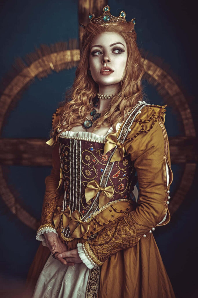 Regal portrait of Anna Henrietta in ornate Renaissance costume with gold embroidery and crown Wallpaper
