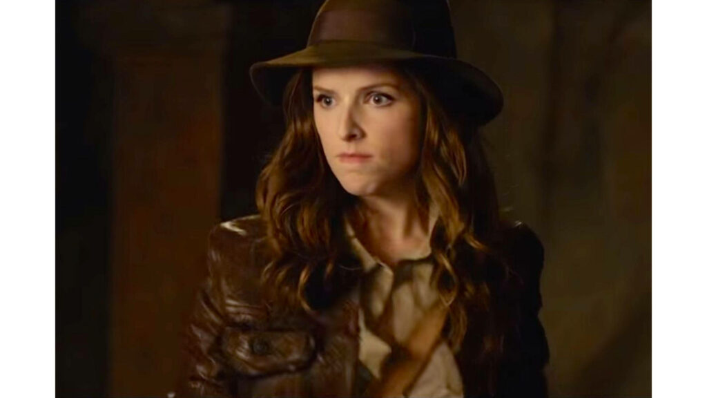 Anna Kendrick as Indiana Jones in brown leather jacket and fedora with adventurous look wallpaper