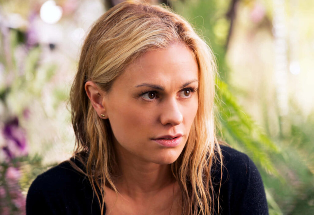 Anna Paquin thoughtful portrait with soft blurred nature background elegant wallpaper design