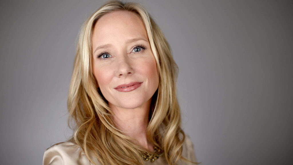 Anne Heche radiant soft smile elegant portrait wallpaper on simple clean background