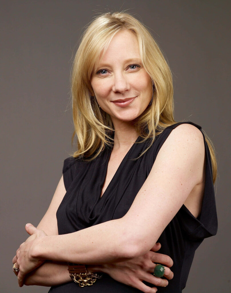 Anne Heche radiant smile natural elegance bright welcoming expression simple wallpaper background