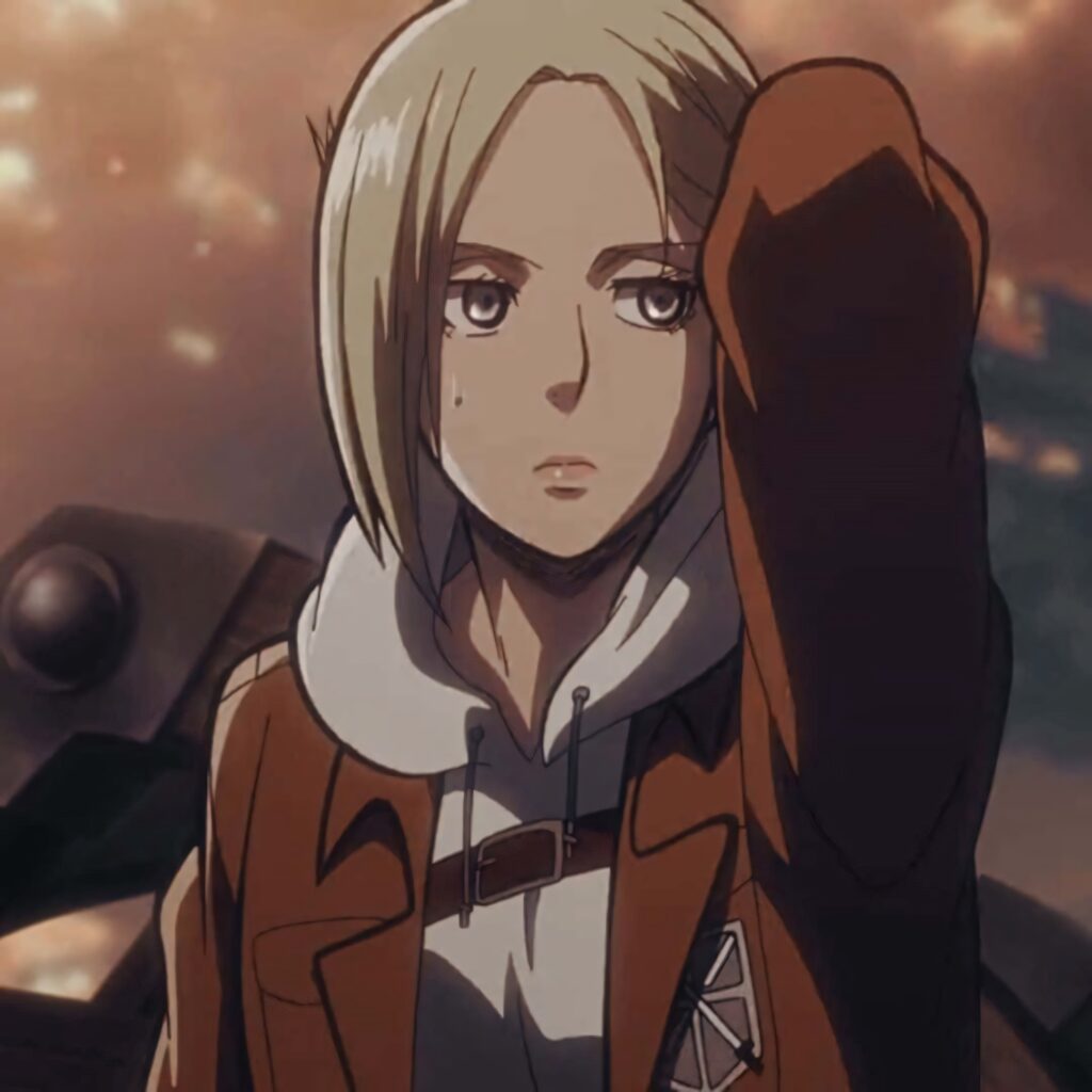 Annie Leonhart in scout uniform stands confidently against dramatic sky Attack on Titan wallpaper