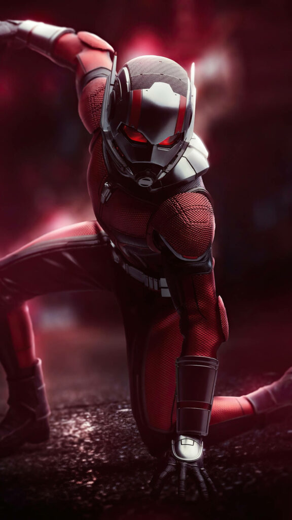 Ant Man superhero in red and black suit in dynamic action pose with dramatic blurred background Wallpaper