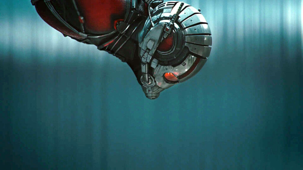 Ant Man mid flight in detailed suit and helmet soaring through blurred blue wallpaper background