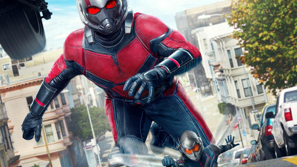 Ant Man in suit racing through city streets demonstrating size-changing powers urban action wallpaper
