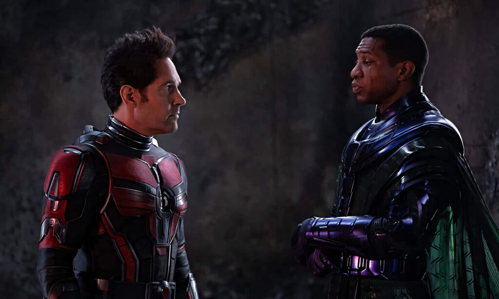 Ant Man confronts Kang in a tense dramatic scene with dark mysterious wallpaper background