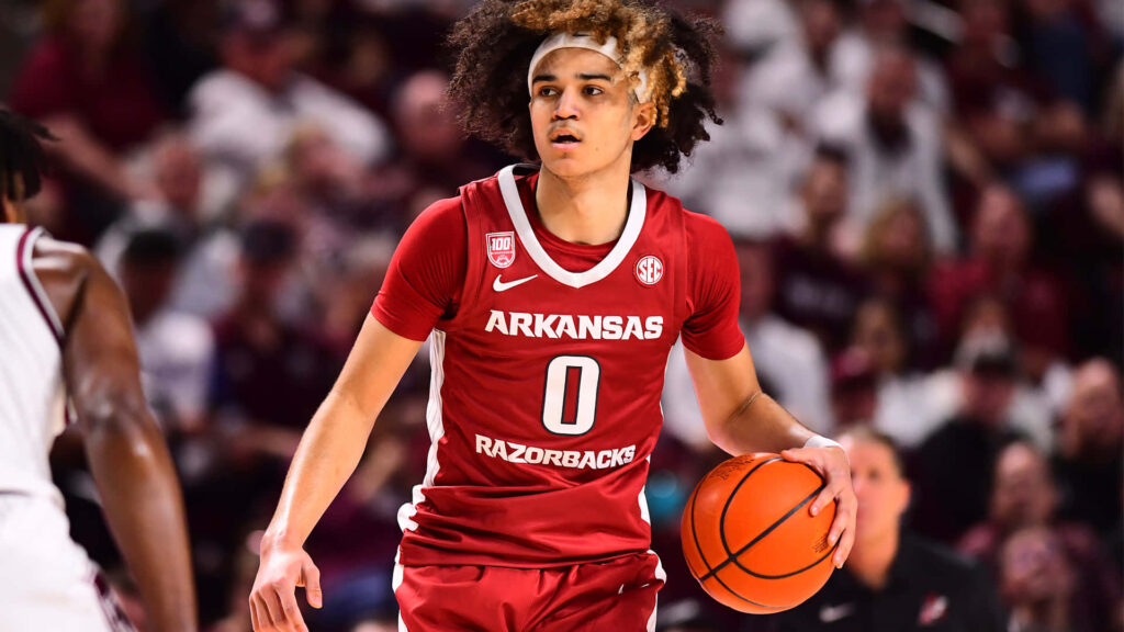 Anthony Black dribbling basketball in Arkansas Razorbacks jersey dynamic game action wallpaper