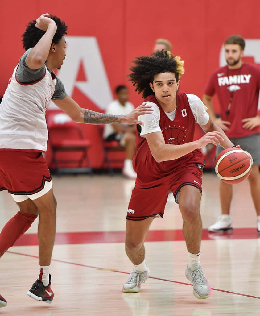 Anthony Black dribbles past defender displaying agility and focus in intense basketball practice Wallpaper