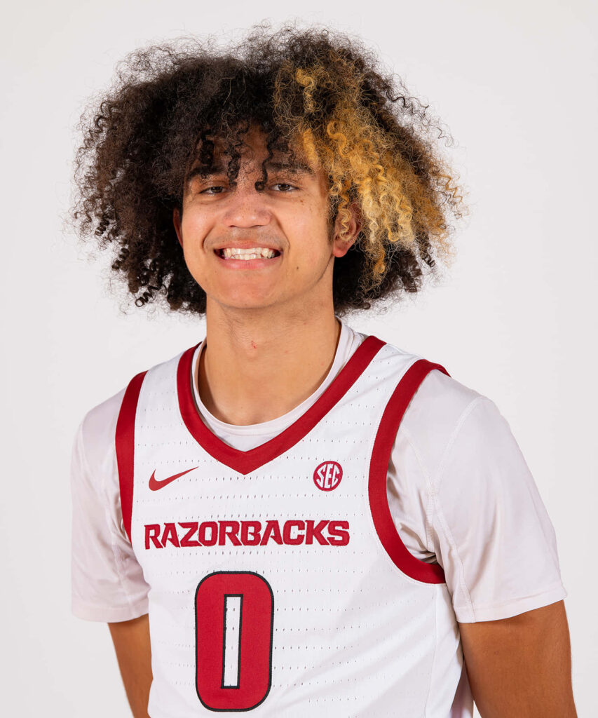 Anthony Black smiling confidently in Razorbacks jersey vibrant athlete wallpaper background