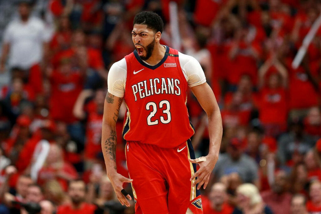 Anthony Davis intense game day emotion New Orleans Pelicans uniform dynamic basketball action Wallpaper