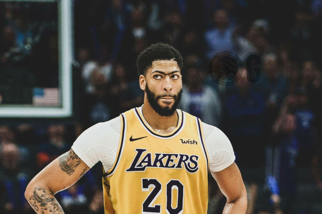 Anthony Davis in Los Angeles Lakers jersey poised on court dynamic basketball wallpaper background