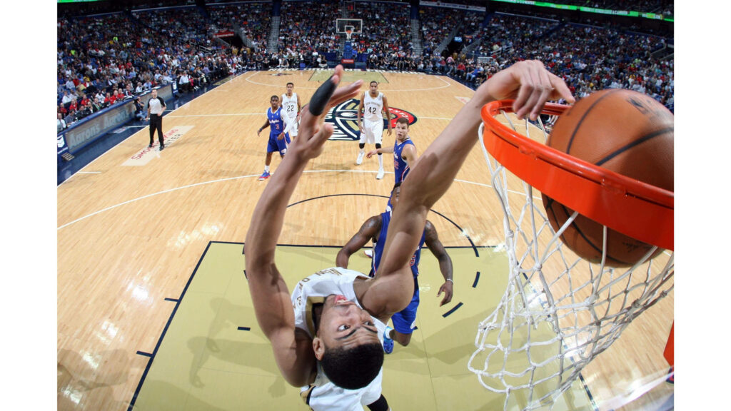 Anthony Davis powerful back dunk NBA game packed arena athletic dominant basketball rim action Wallpaper