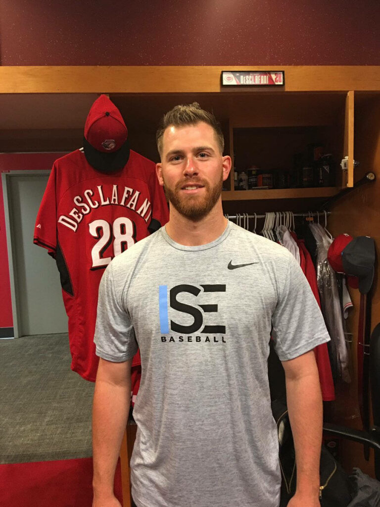 Anthony DeSclafani in baseball locker room with team jersey gear behind him behind the scenes Wallpaper