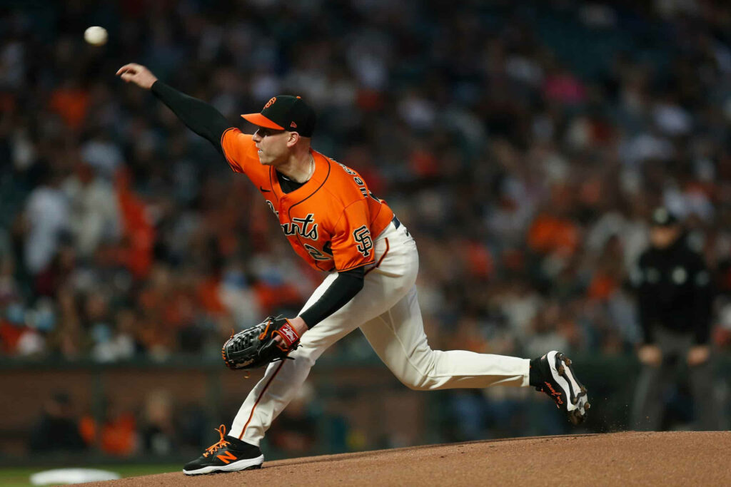 Anthony DeSclafani pitching with focused release form on baseball mound dynamic wallpaper background