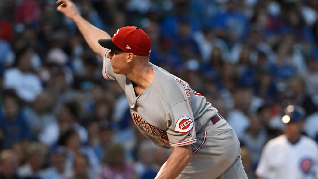 Anthony DeSclafani pitching powerfully mid-throw on baseball field during intense game wallpaper