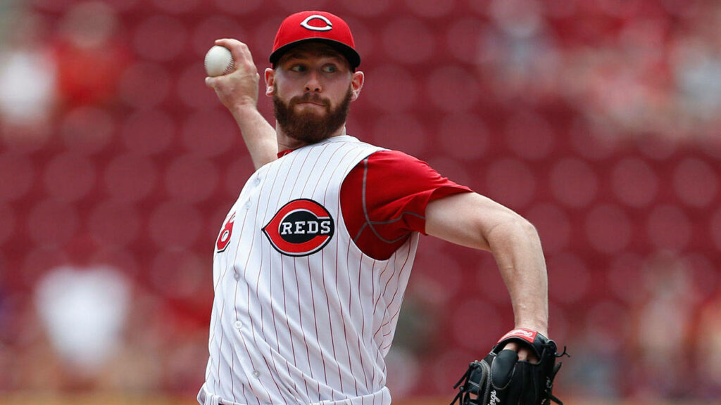 Anthony DeSclafani pitching with intense focus for Cincinnati Reds baseball wallpaper background
