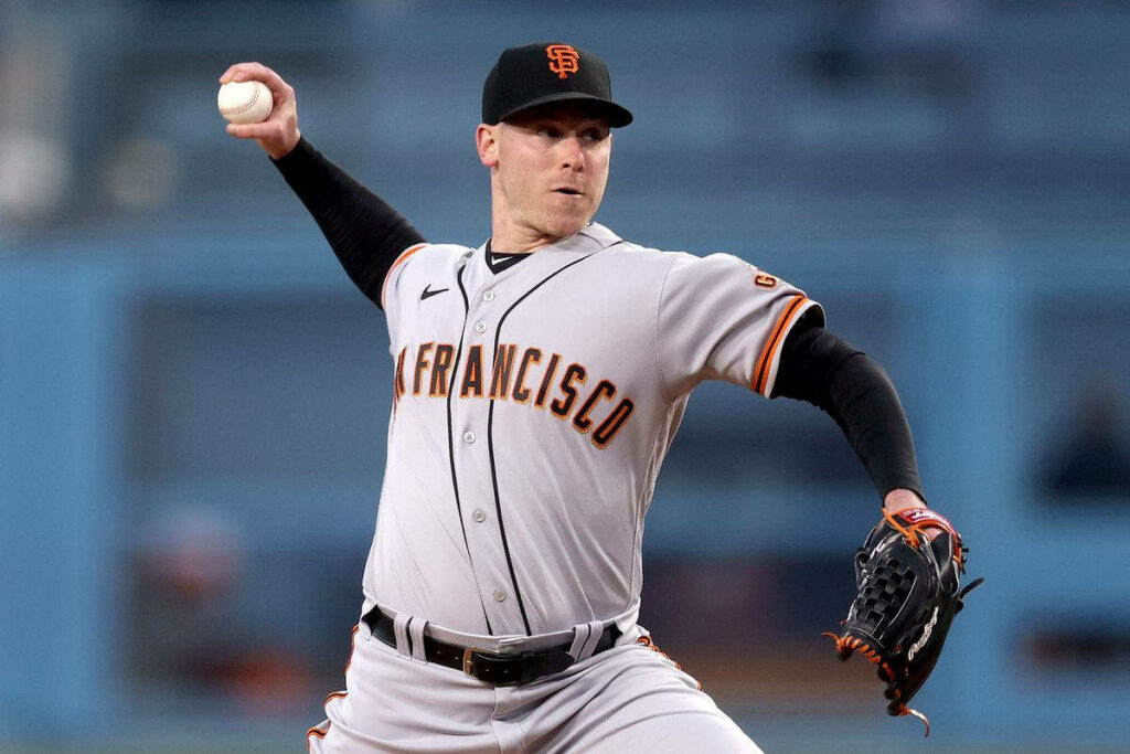Anthony DeSclafani pitching intensely in San Francisco Giants uniform on the mound wallpaper background