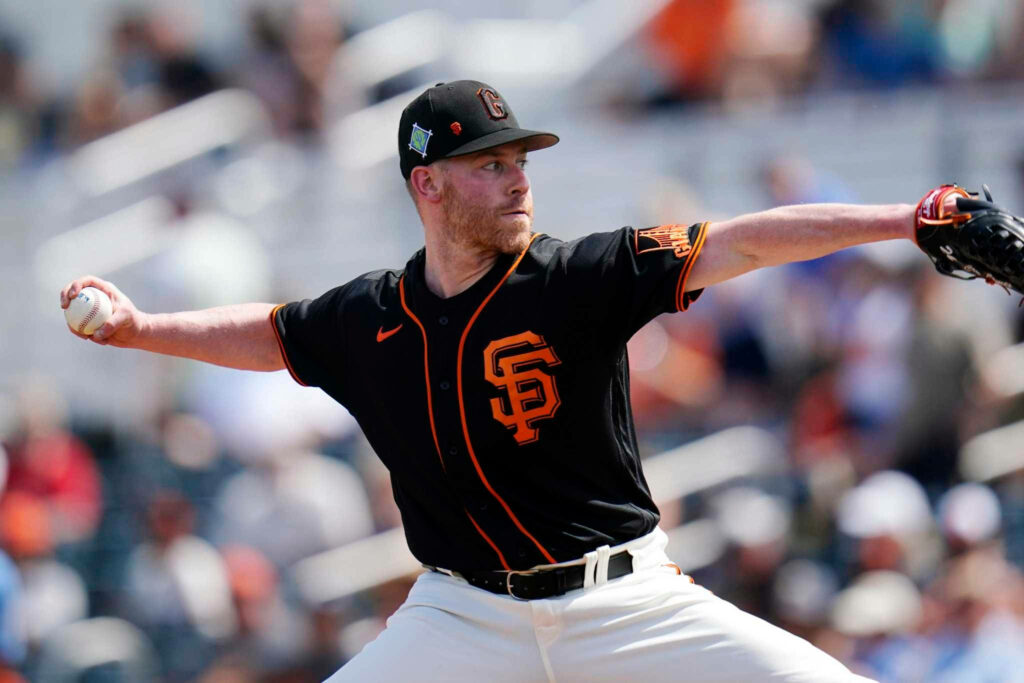 Anthony DeSclafani pitching for San Francisco Giants showing focus and control on mound Wallpaper