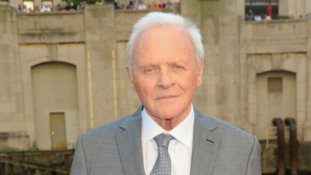 Anthony Hopkins in classic grey sweater exuding timeless charm and sophisticated style wallpaper
