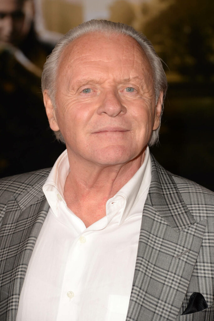 Anthony Hopkins wearing stylish checkered suit confident elegant portrait wallpaper background