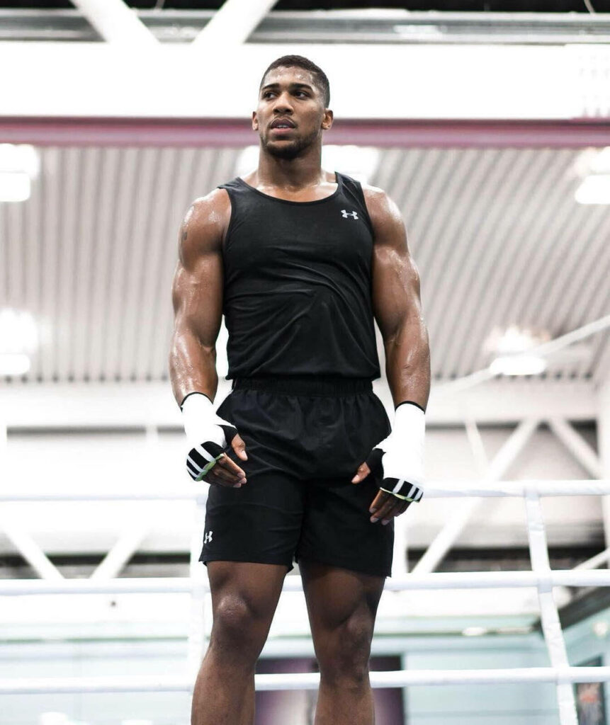 Anthony Joshua in gym showing muscular physique and athletic strength dynamic boxing wallpaper