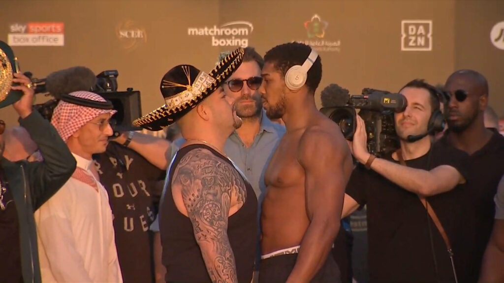 Anthony Joshua and Andy Ruiz Jr intense pre-fight face off with cameras capturing boxing rivalry wallpaper