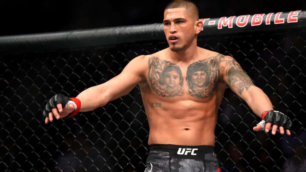 Anthony Pettis in cage displaying athletic physique and striking tattoos Professional Fighters League wallpaper