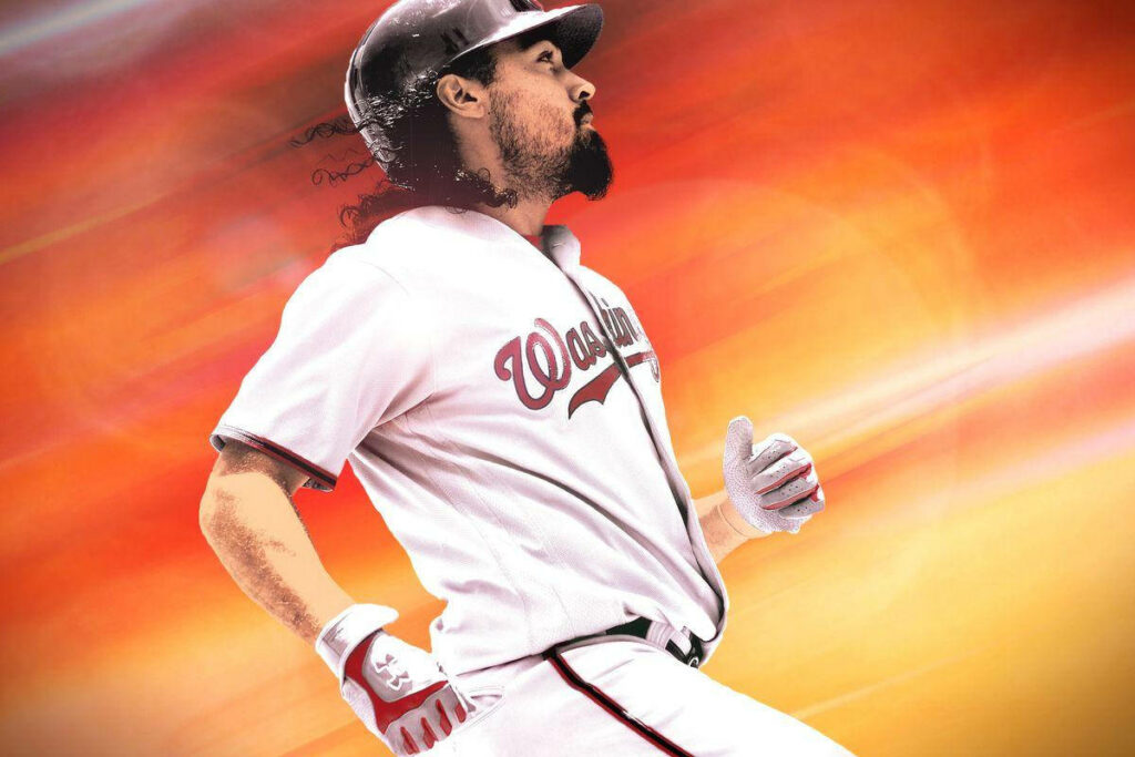 Anthony Rendon running with determination on baseball field dynamic orange blurred background Wallpaper