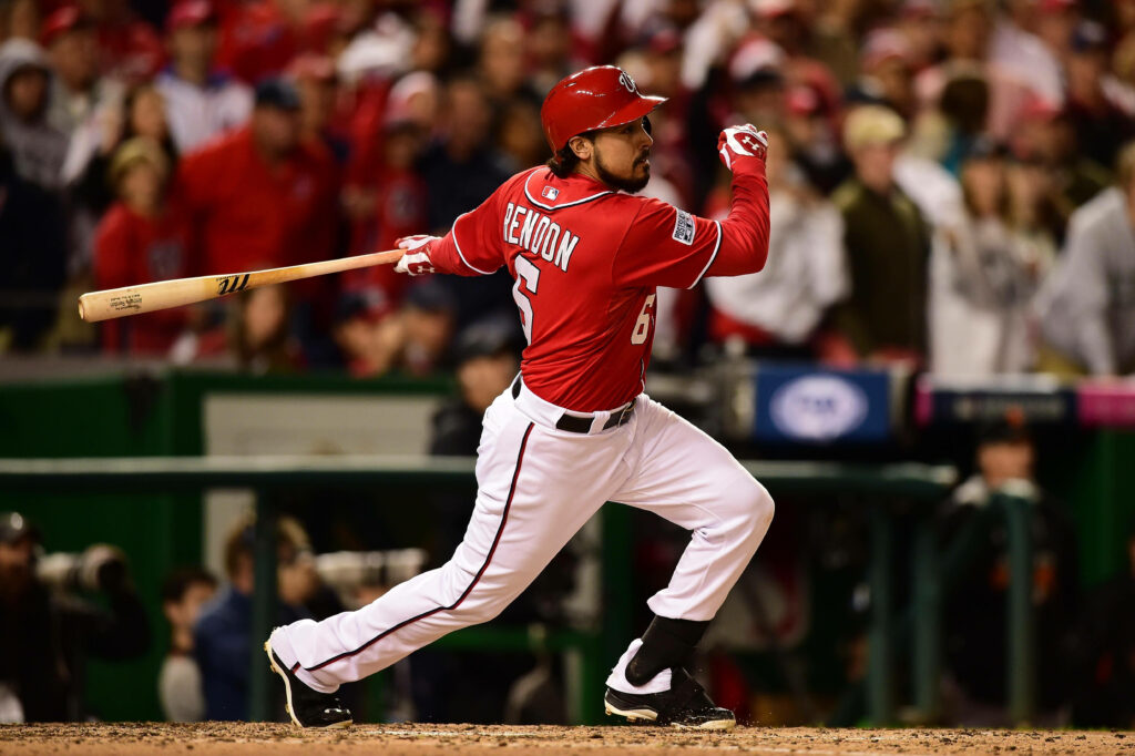 Anthony Rendon swinging bat mid-run showcasing athleticism and focus in baseball game wallpaper