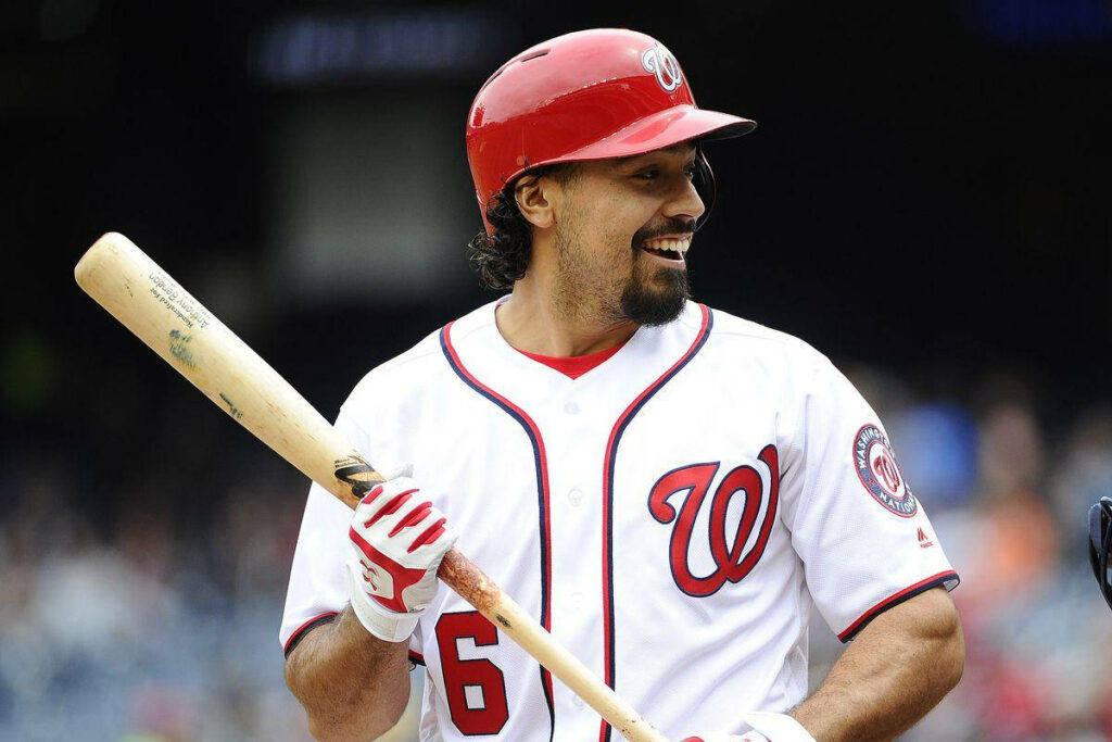 Anthony Rendon smiling in Washington Nationals uniform holding baseball bat vibrant wallpaper