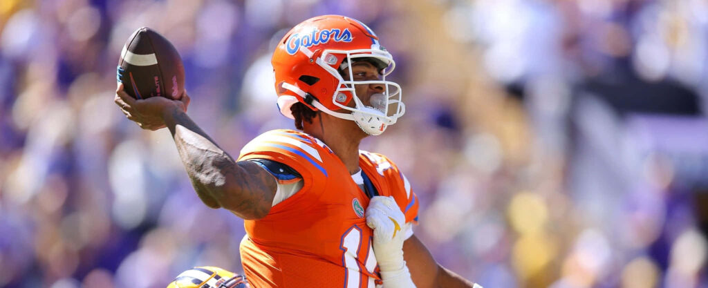 Anthony Richardson in orange Florida Gators uniform throwing football on field dynamic action wallpaper