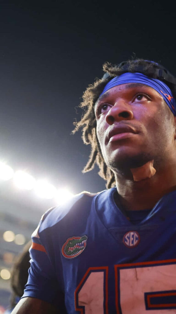 Anthony Richardson Florida Gators football player under stadium lights focused intense expression wallpaper