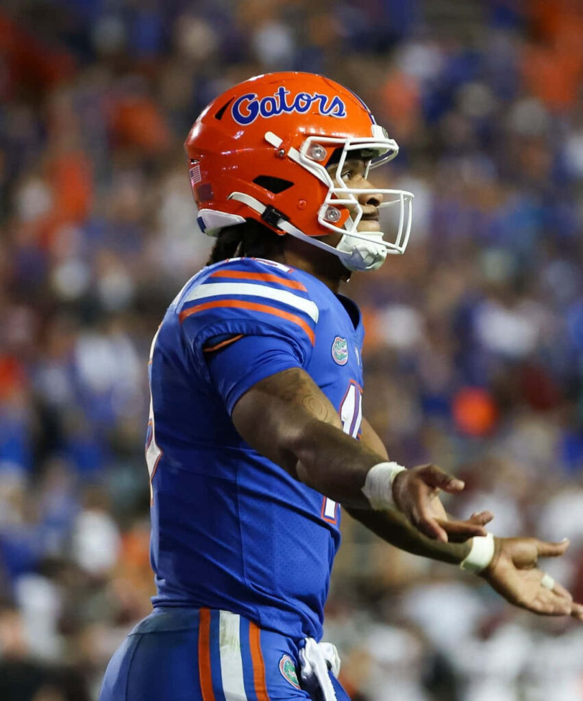 Anthony Richardson in Gators uniform showing intense focus and athletic energy on football field Wallpaper