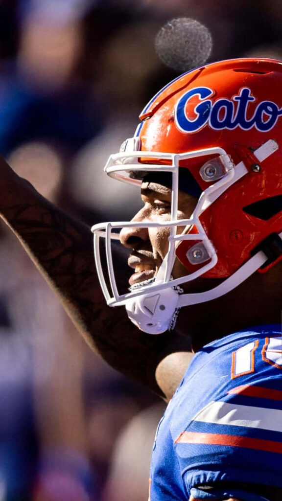 Anthony Richardson Gators football player intense game moment vibrant stadium wallpaper background