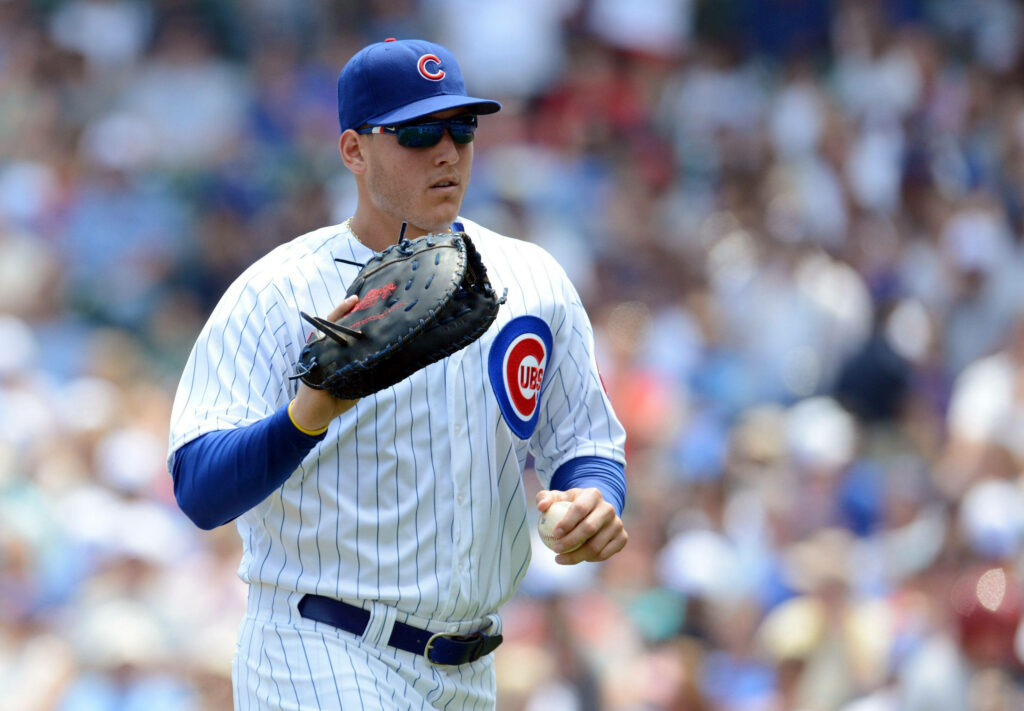 Anthony Rizzo Chicago Cubs baseball player wearing sunglasses and gloves on field action shot Wallpaper