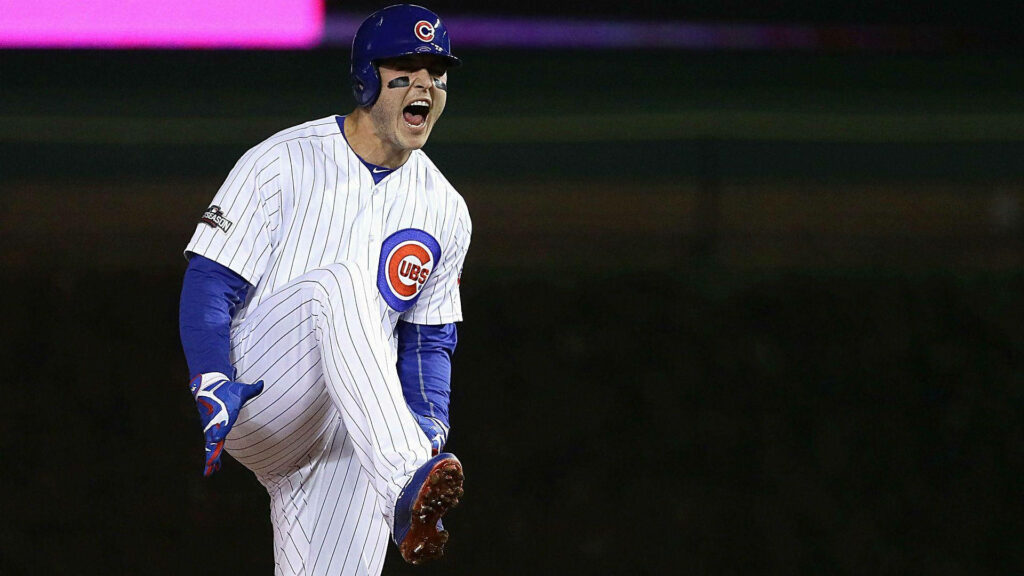 Anthony Rizzo Chicago Cubs celebrating on field with leg raised energetic baseball wallpaper